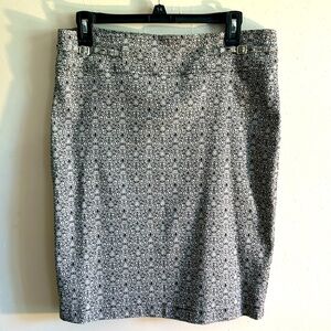 Soho black-and-white pencil skirt. Super stretchy cute little buckles